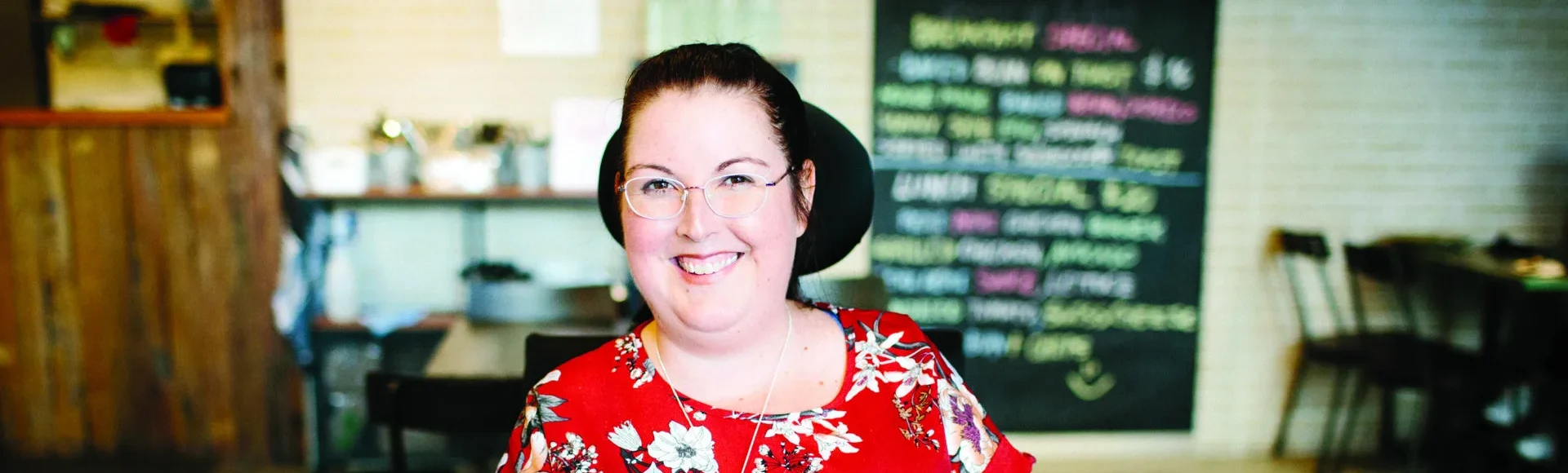 Kristie sitting in a coffee shop