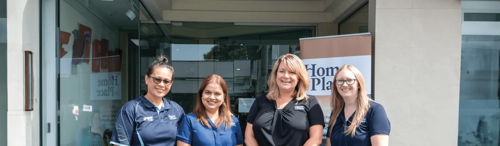 Four women standing in front of the Home In Place Brisbane office