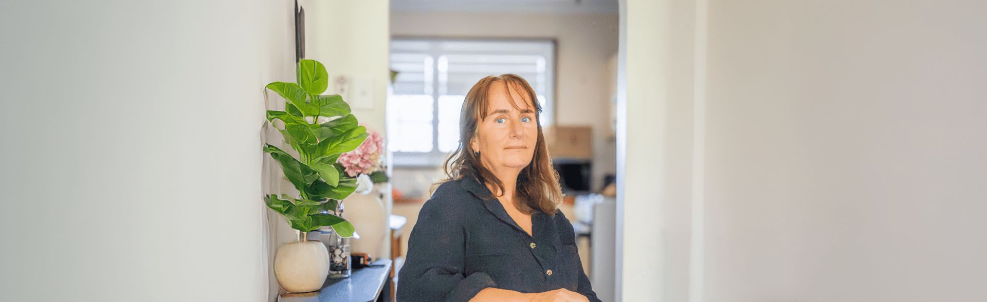 Woman sitting at the kitchen table