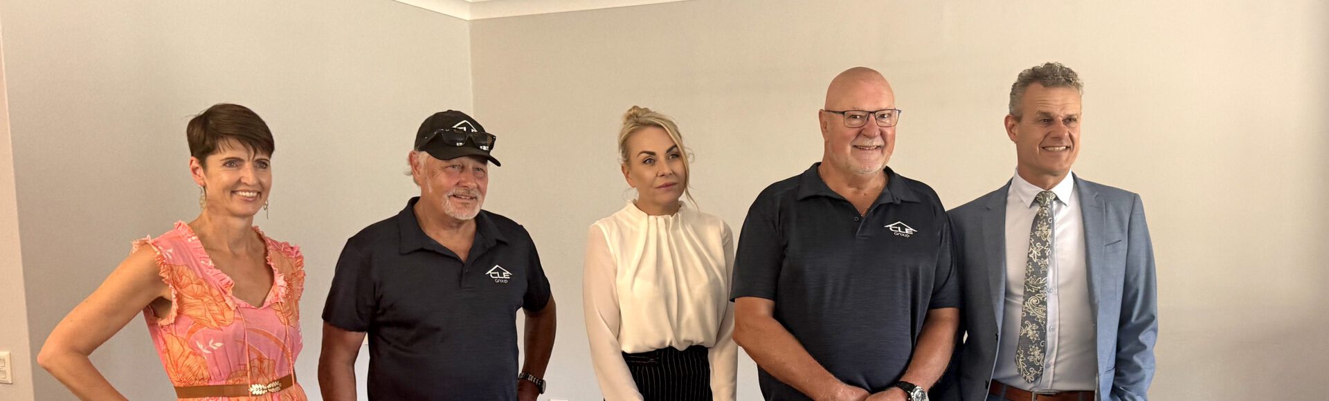 Group of five people inside a house