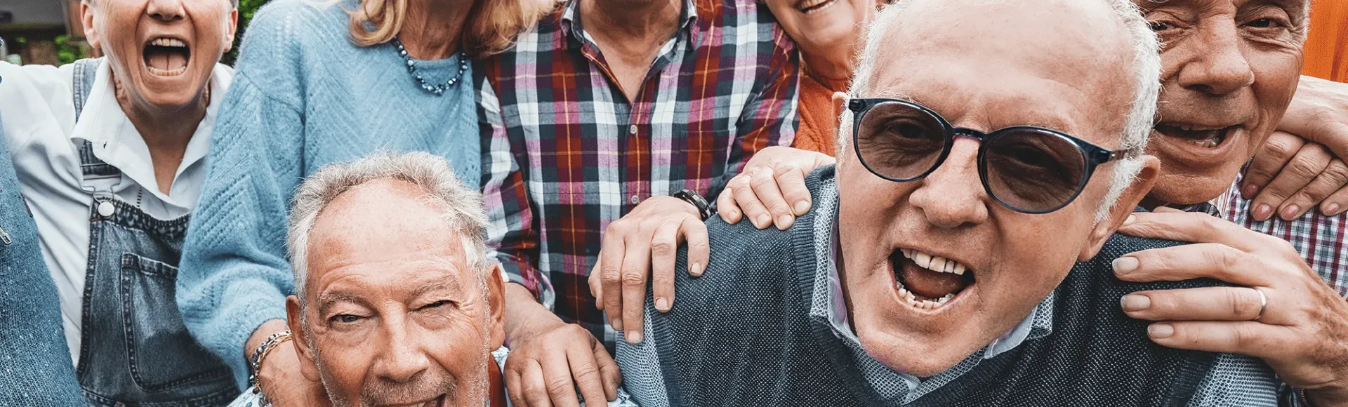 Group of senior people smiling into the camera