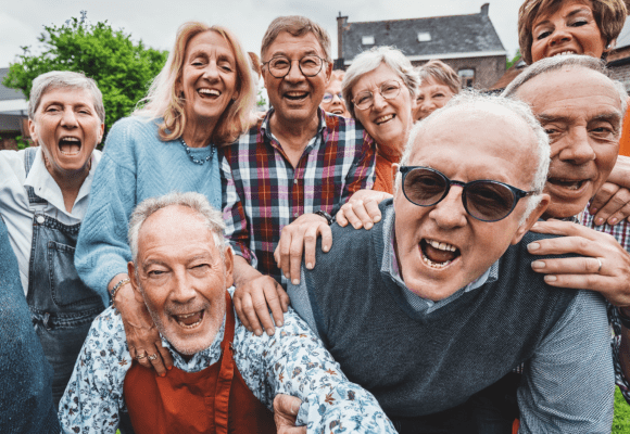 Group of senior people smiling into the camera