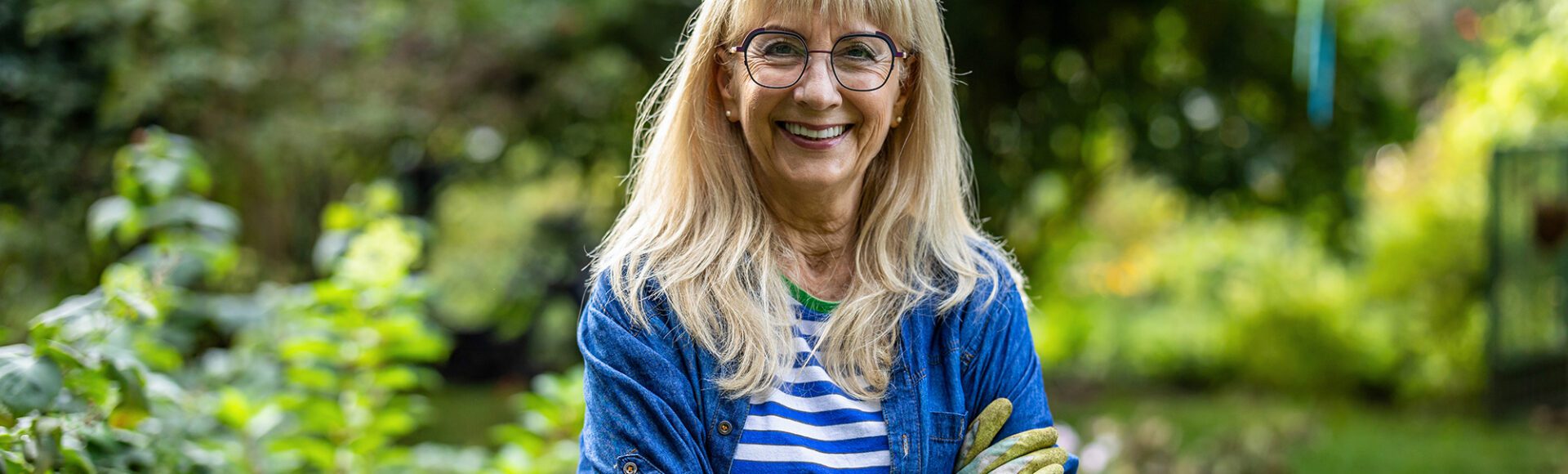 Happy woman in a garden smiling