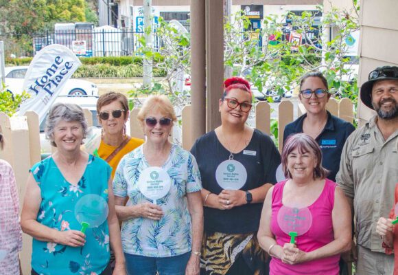 A group of 10 people at a Community Greening event