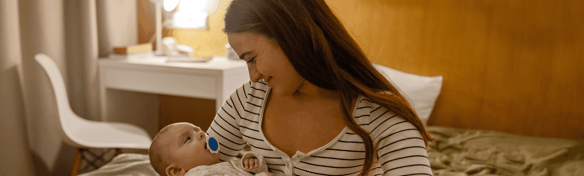 A mother holding her baby