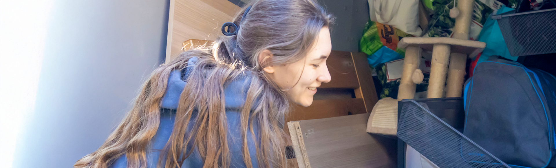Woman stacking furniture and household items